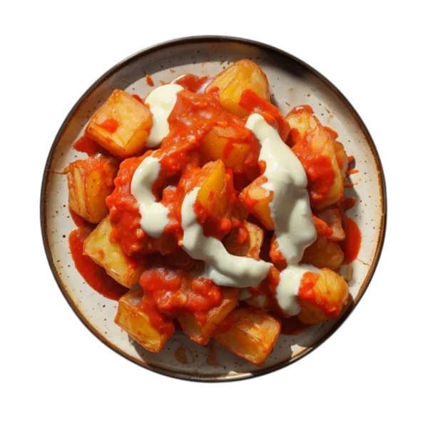 Patatas bravas con salsa brava y mayonesa en Kokcha Barcelona