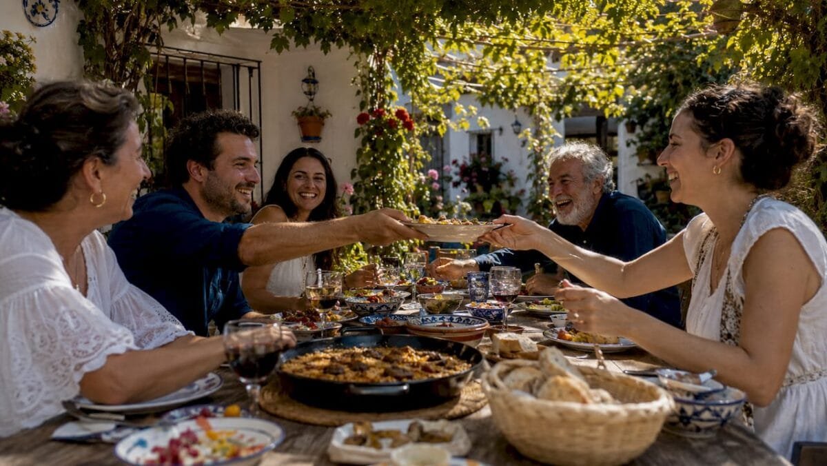 Spanish family enjoying communal outdoor meal