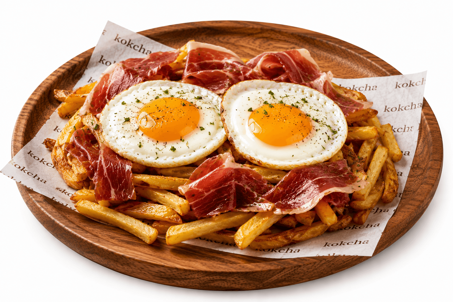 Huevos rotos con patatas crujientes y jamón ibérico en Kokcha Sagrada Familia