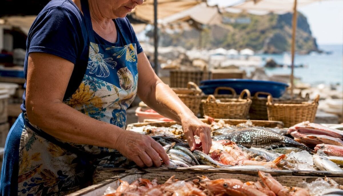 Spanish seafood market vendor sorting fresh catch
