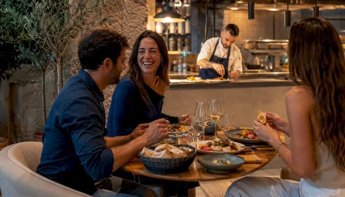 Contemporary Mediterranean restaurant interior with open kitchen